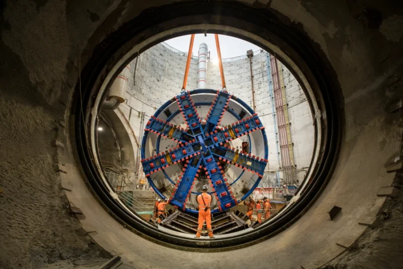 Worker in tunnel entrance construction site